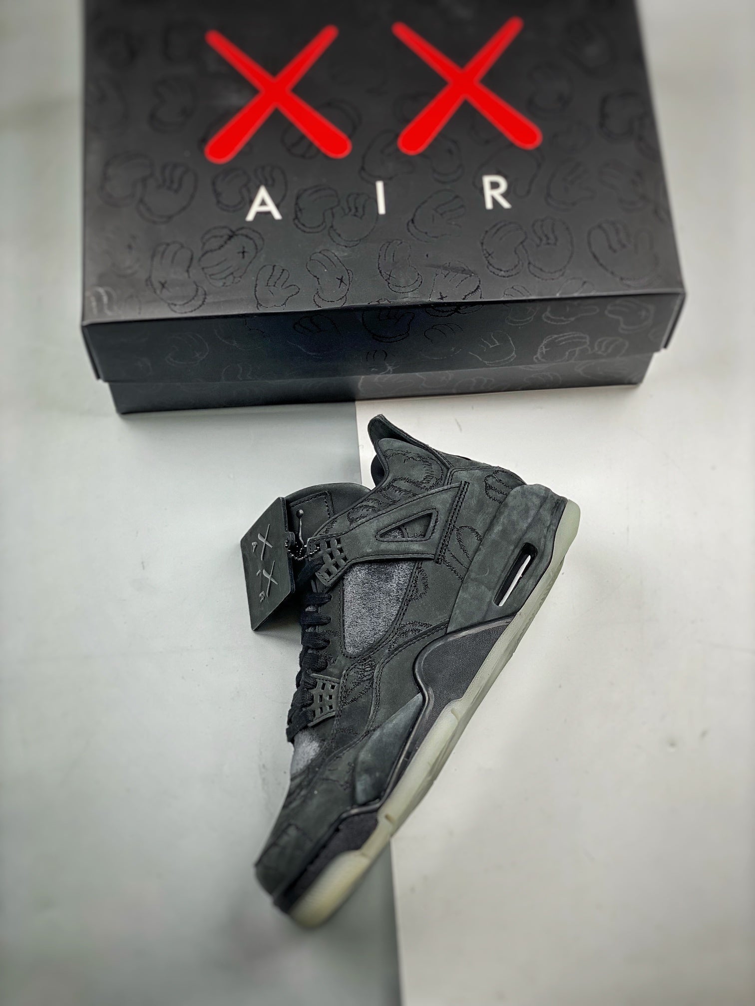 Jordan 4 Retro x KAWS 'Black'