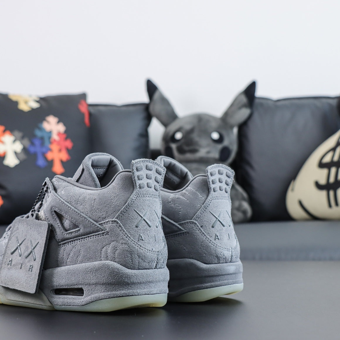 Jordan 4 Retro x KAWS 'Cool Grey'