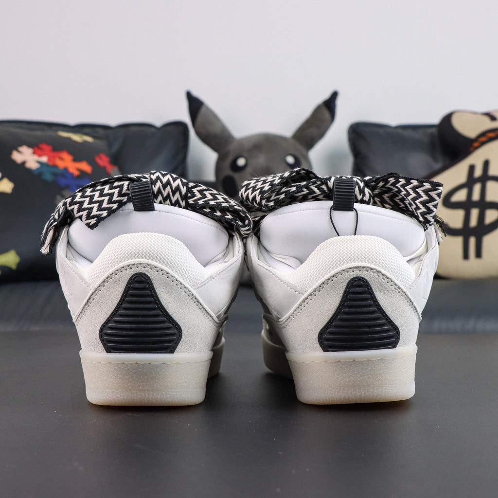 LANVIN SNEAKER white with oversized black-and-white zigzag-print laces and a transparent rubber sole