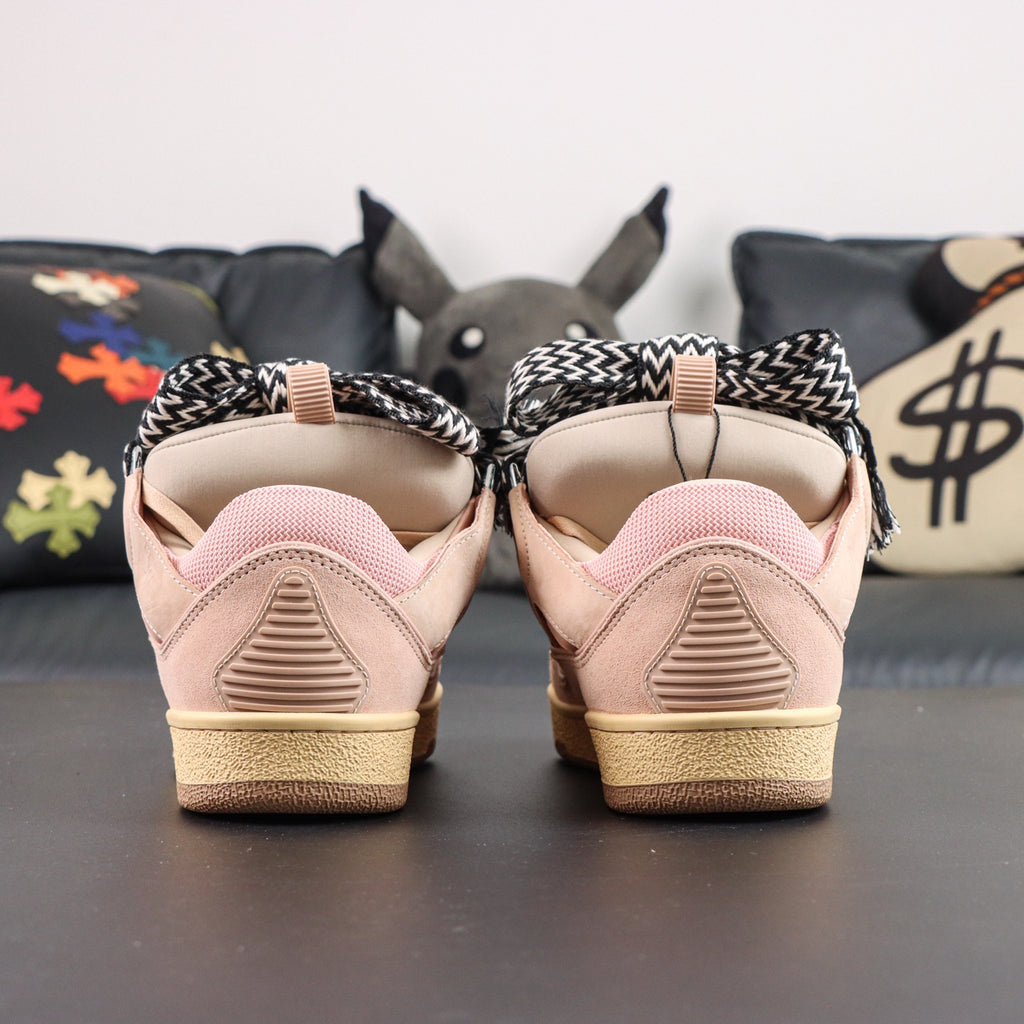 LANVIN SNEAKER  pink colorway, featuring an oversized padded tongue and wide black-and-white zigzag laces