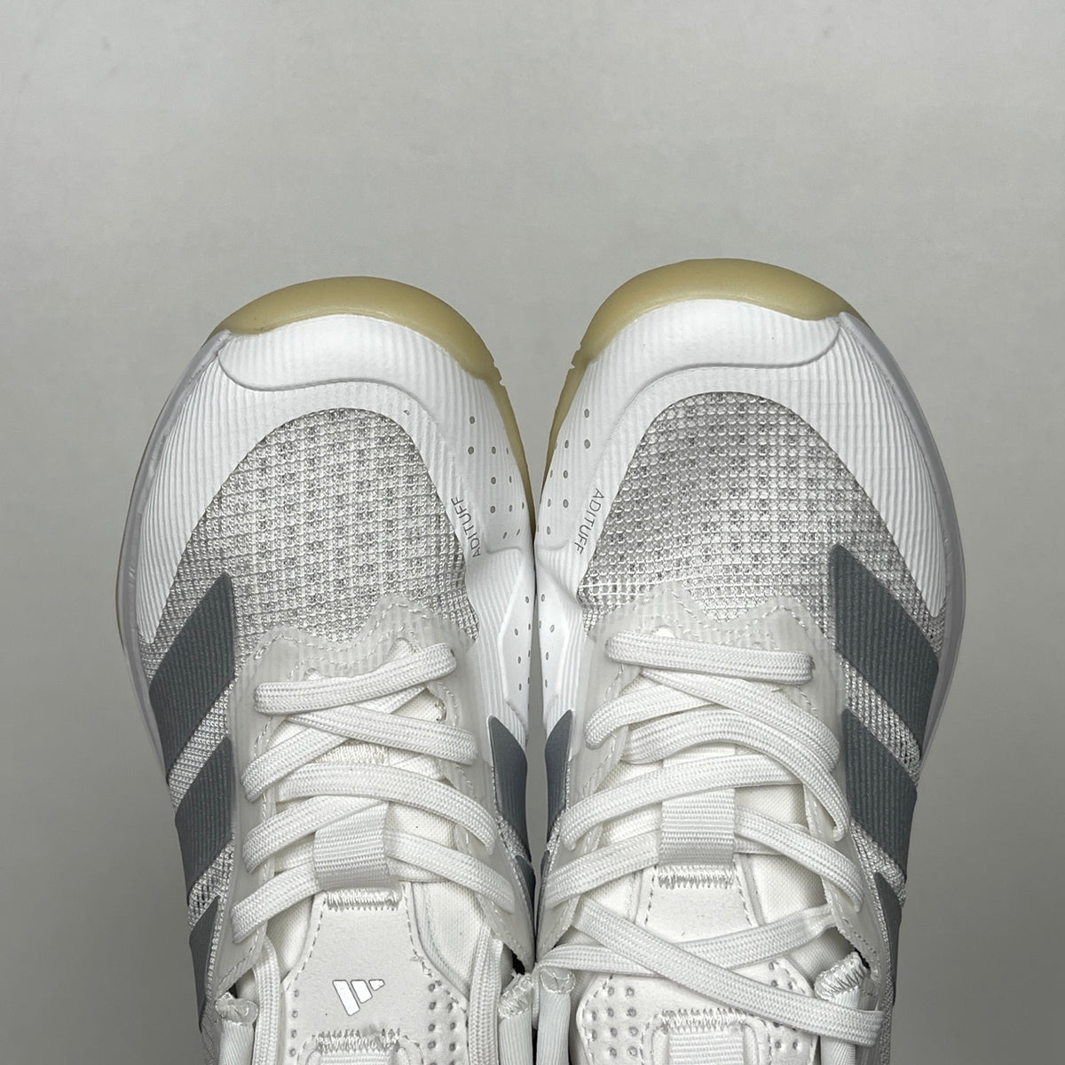 AD ADIZERO UBERSONIC 5 tennis shoes in the Cloud White / Silver Metallic