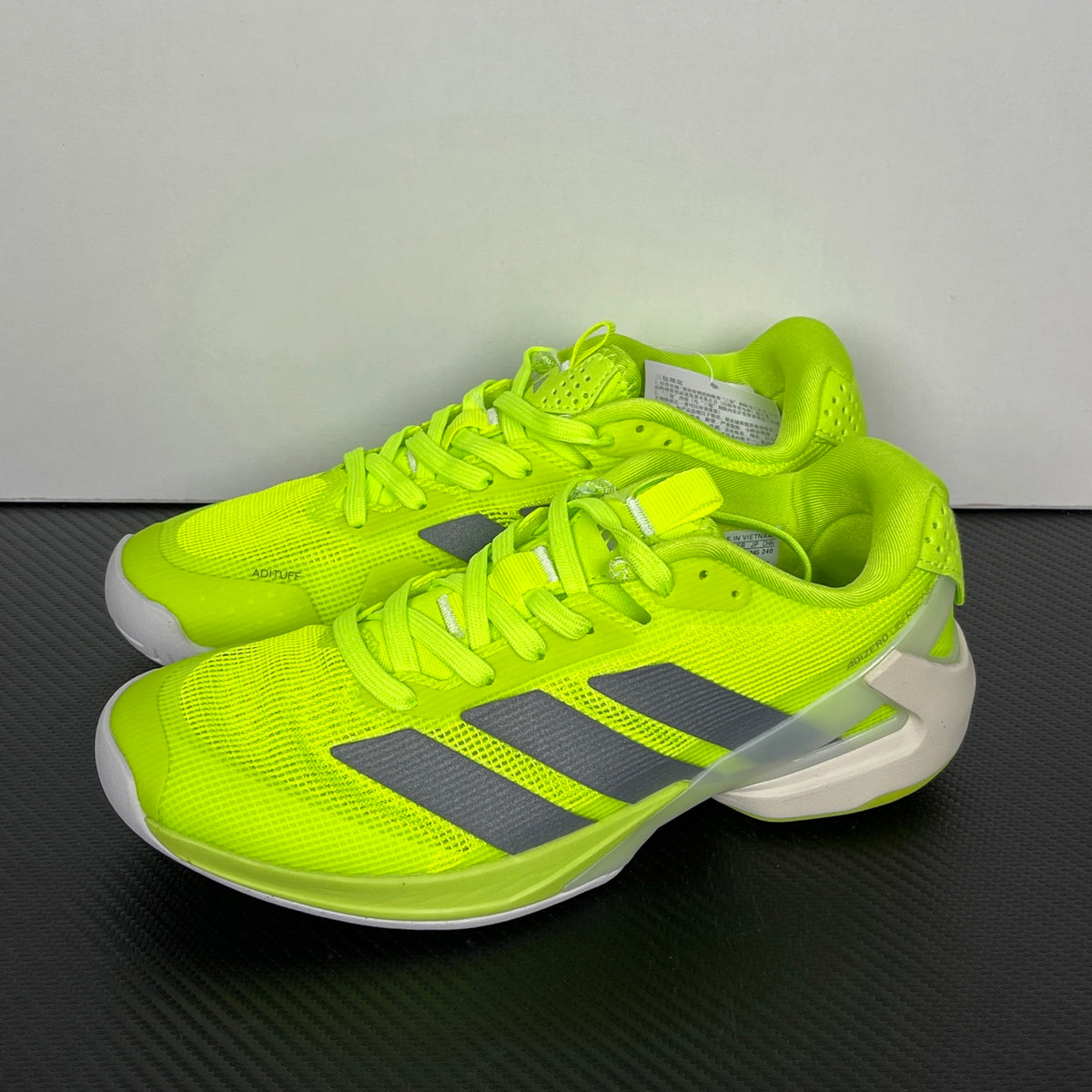 AD ADIZERO UBERSONIC 5 Tennis Shoes in the Lucid Lemon / Iron Metallic / Powder Yellow