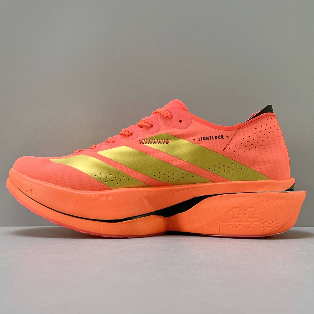 Adidas Adizero Adios Pro 5 bright coral-red and metallic gold