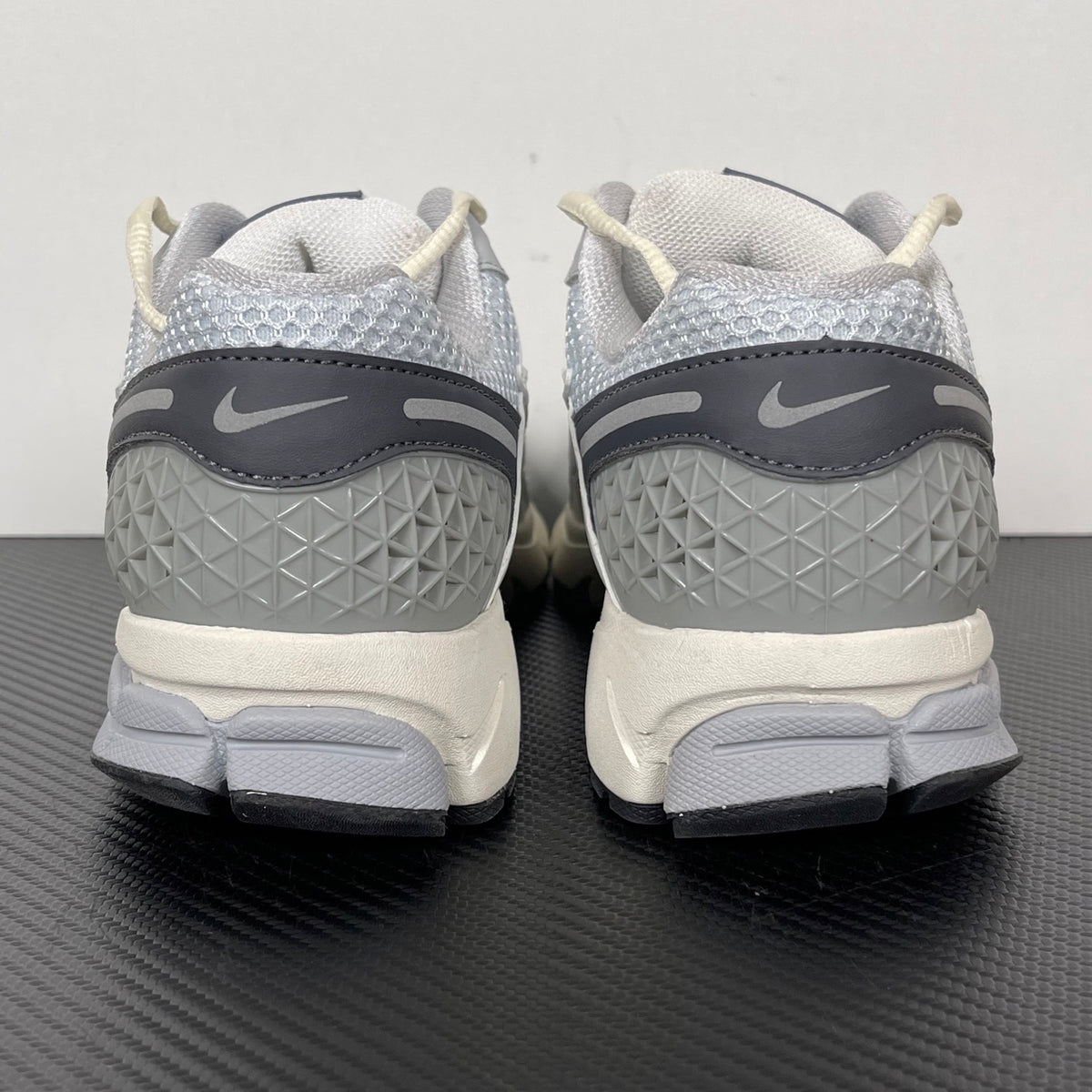 NIKE AIR ZOOM VOMERO 5  grey, platinum, and white