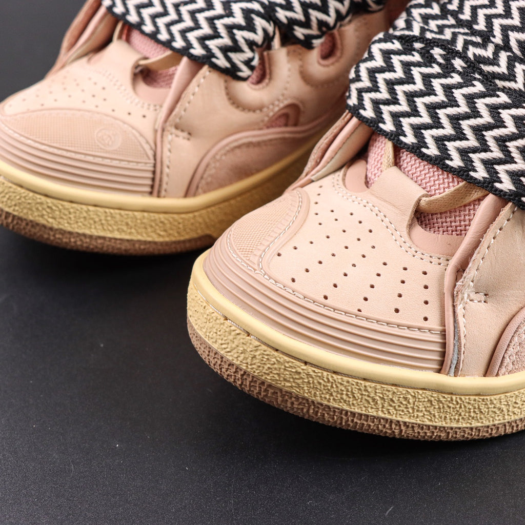 LANVIN SNEAKER  pink colorway, featuring an oversized padded tongue and wide black-and-white zigzag laces