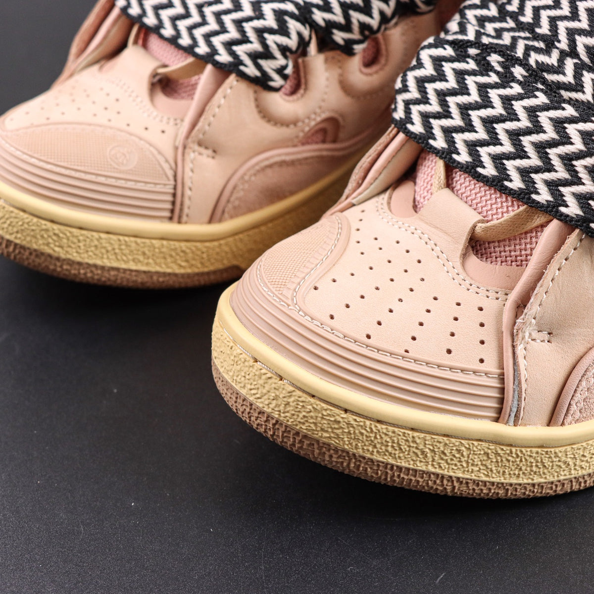 LANVIN SNEAKER  pink colorway, featuring an oversized padded tongue and wide black-and-white zigzag laces