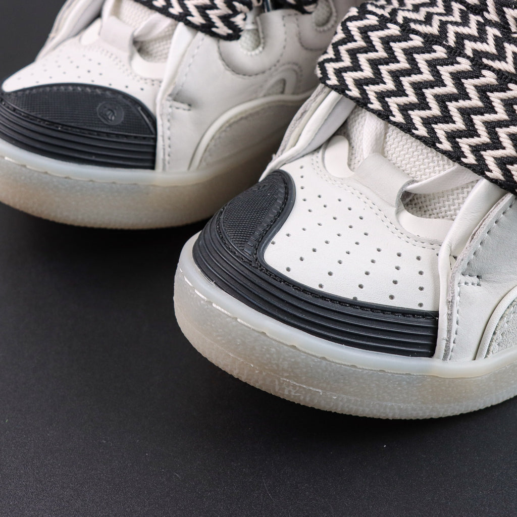 LANVIN SNEAKER white with oversized black-and-white zigzag-print laces and a transparent rubber sole