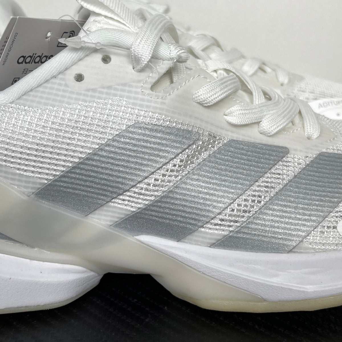 AD ADIZERO UBERSONIC 5 tennis shoes in the Cloud White / Silver Metallic
