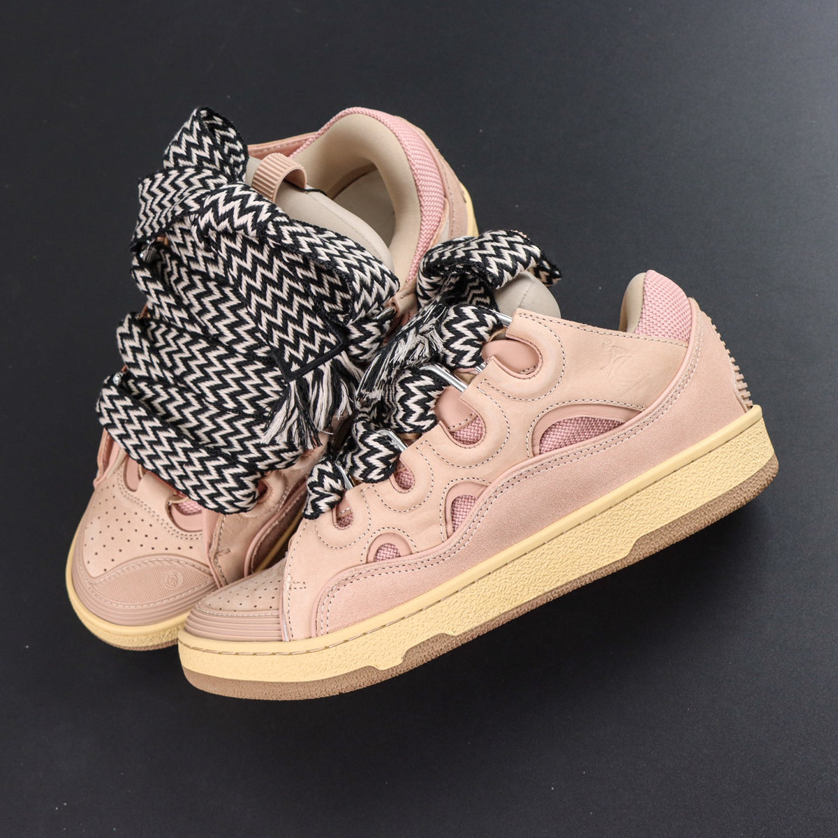 LANVIN SNEAKER  pink colorway, featuring an oversized padded tongue and wide black-and-white zigzag laces