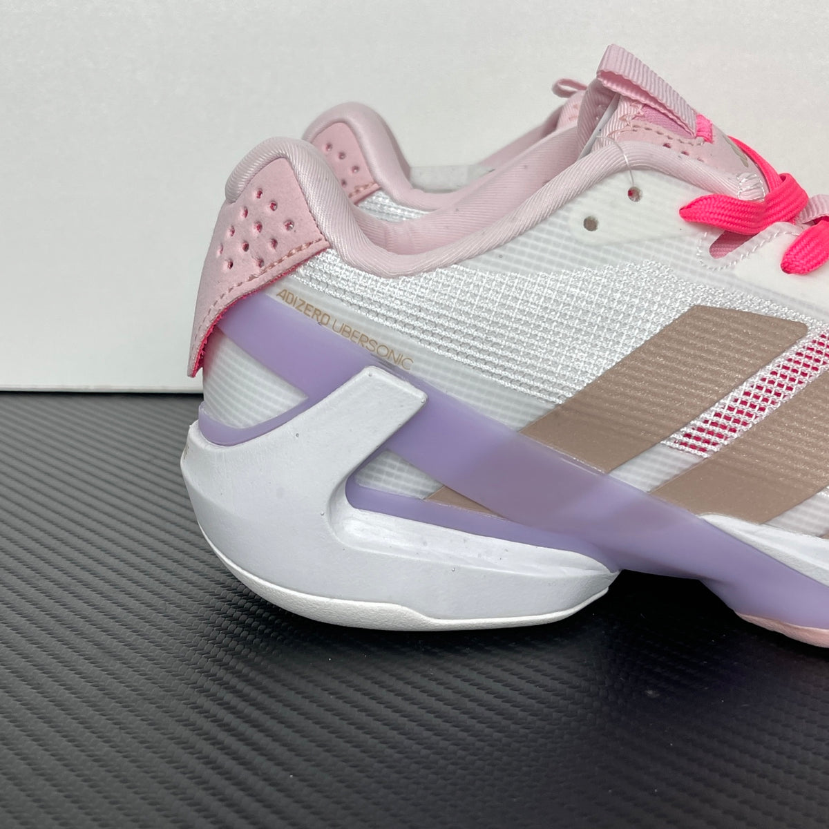 AD ADIZERO UBERSONIC 5 (in the Cloud White, Ash Pearl, and Lucid Pink / JP7313 colorway).