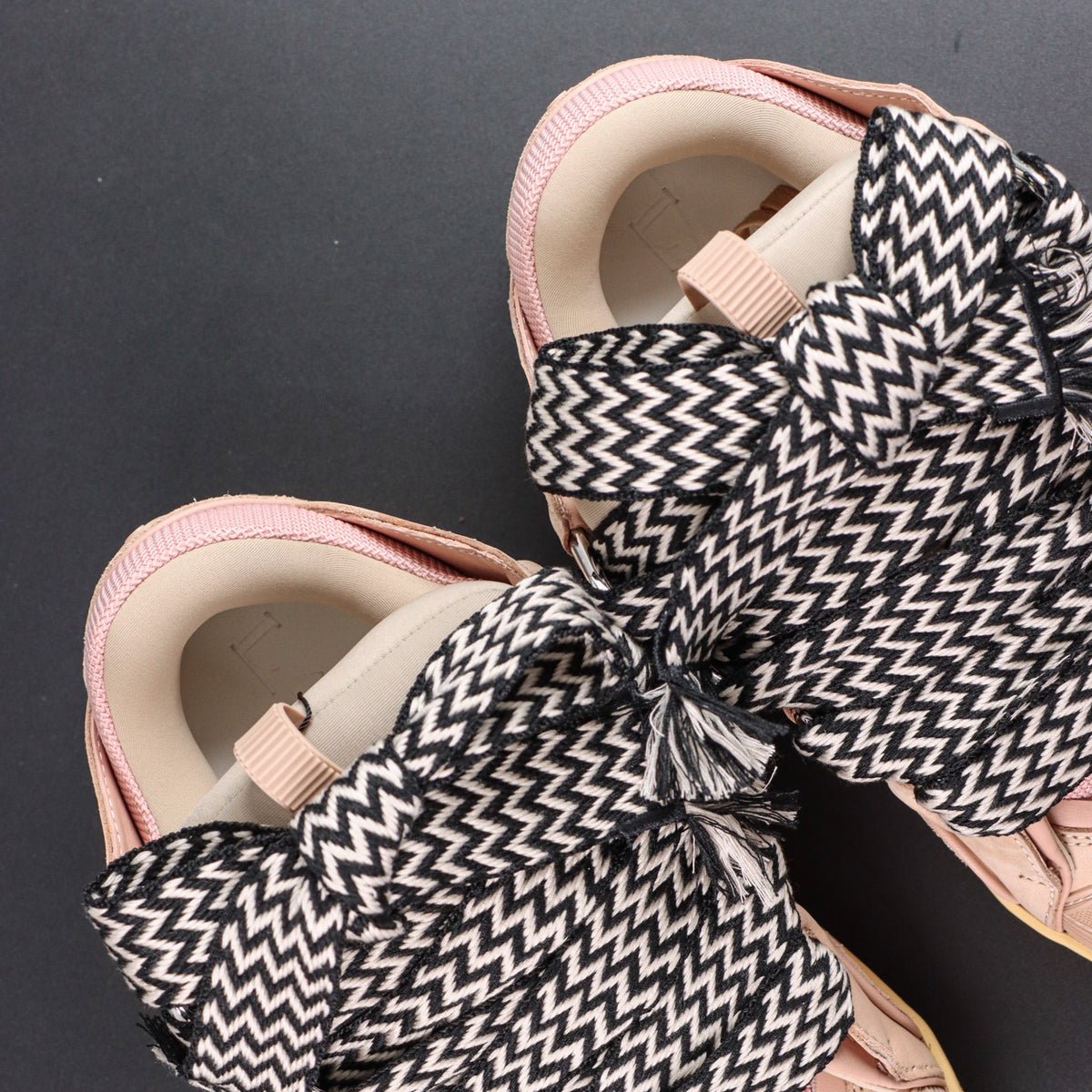LANVIN SNEAKER  pink colorway, featuring an oversized padded tongue and wide black-and-white zigzag laces