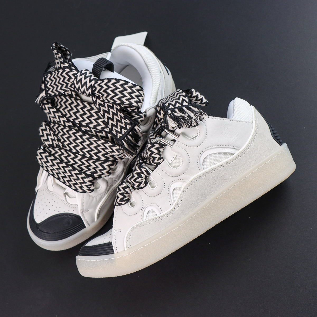 LANVIN SNEAKER white with oversized black-and-white zigzag-print laces and a transparent rubber sole