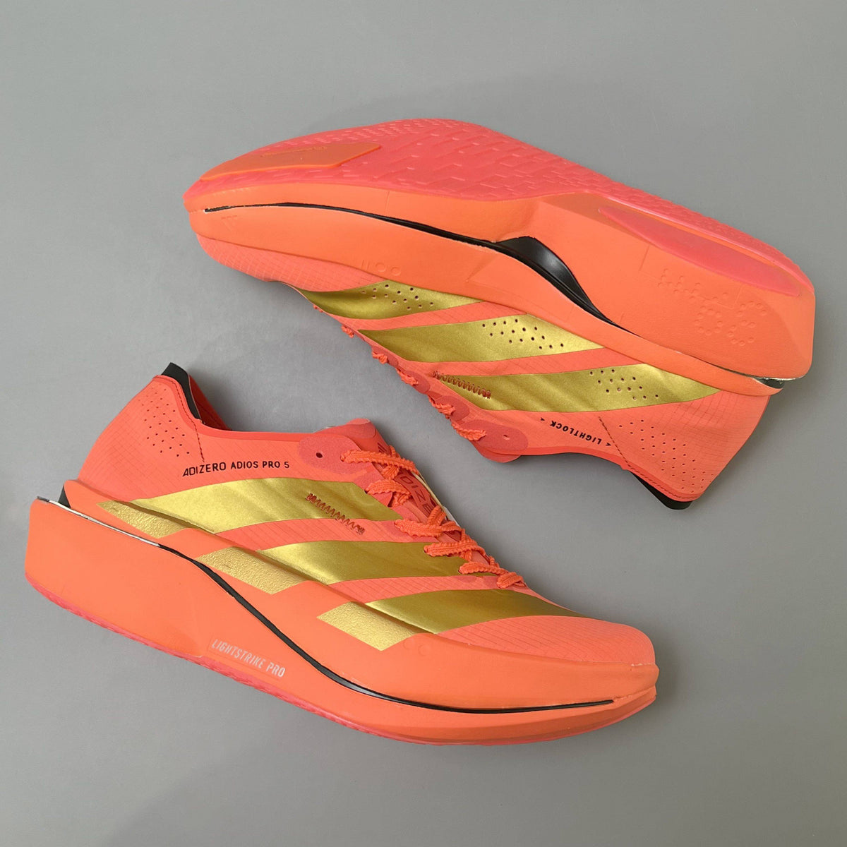 Adidas Adizero Adios Pro 5 bright coral-red and metallic gold