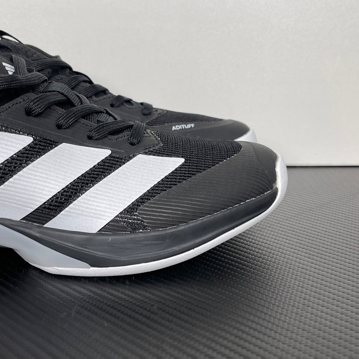 AD ADIZERO UBERSONIC 5 Tennis Shoes in Core Black / Zero Metallic / Silver Metallic