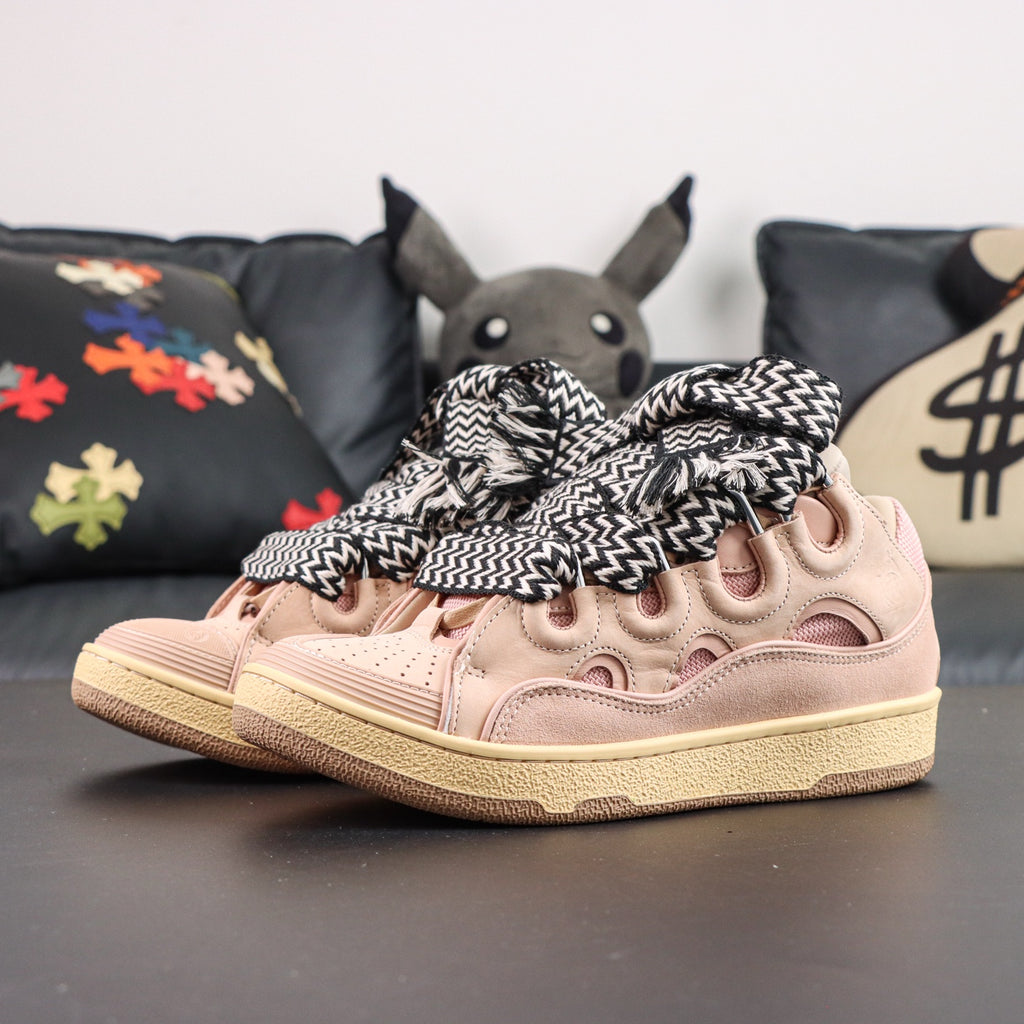 LANVIN SNEAKER  pink colorway, featuring an oversized padded tongue and wide black-and-white zigzag laces